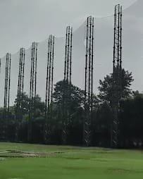 Perimeter poles supporting a sports safety net